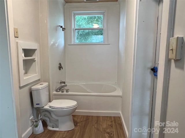 bathroom with toilet and hardwood / wood-style flooring