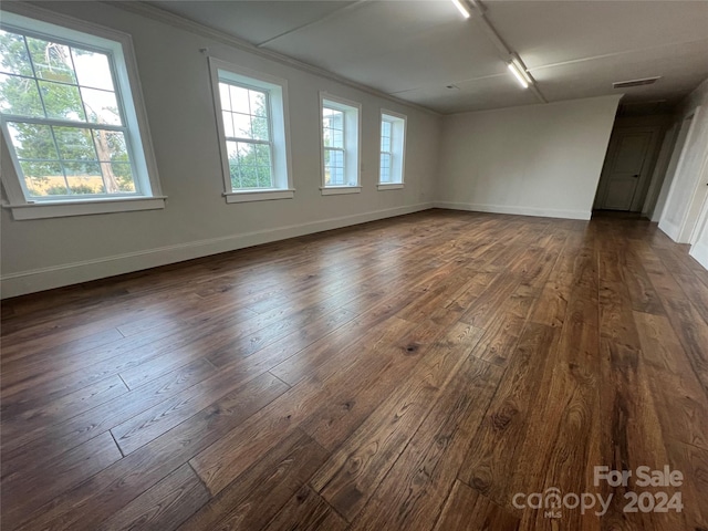 unfurnished room featuring dark hardwood / wood-style flooring