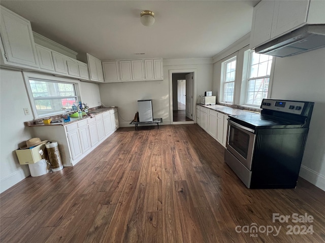 kitchen featuring white cabinets, ventilation hood, dark hardwood / wood-style flooring, and stainless steel range with electric stovetop