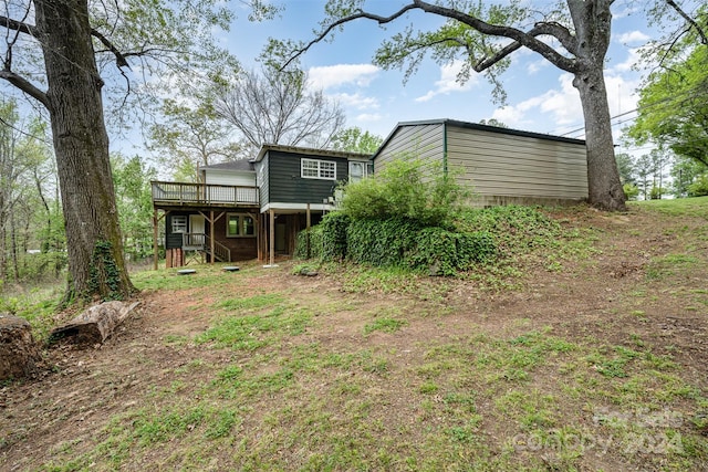 view of yard featuring a wooden deck