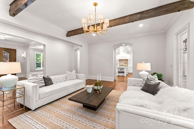 living room with wood-type flooring, beam ceiling, and crown molding