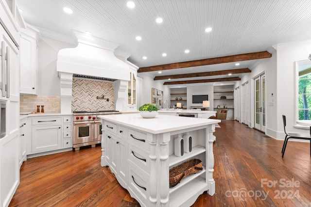 kitchen with a kitchen island, double oven range, tasteful backsplash, white cabinetry, and dark wood-type flooring