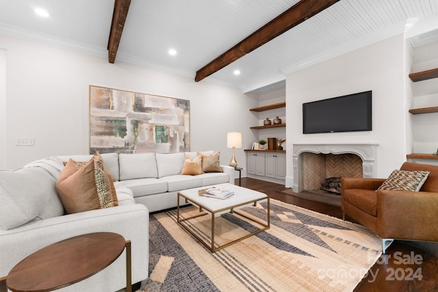 living room with wood-type flooring, beam ceiling, crown molding, and built in features