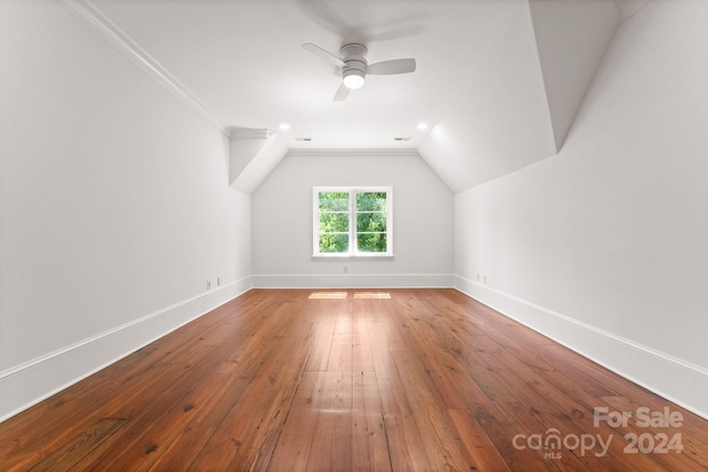 bonus room with wood-type flooring, ceiling fan, and vaulted ceiling