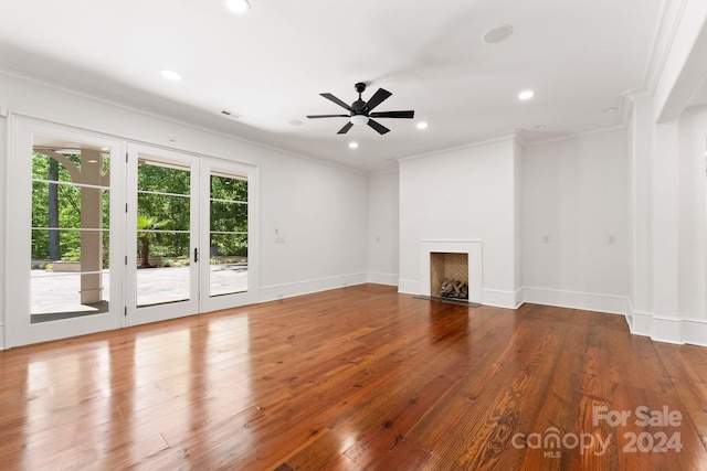 unfurnished living room with crown molding, ceiling fan, and hardwood / wood-style floors