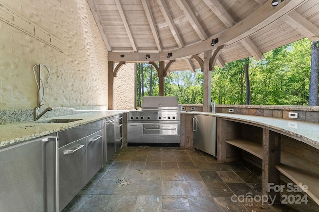 view of patio / terrace featuring a grill, sink, and area for grilling