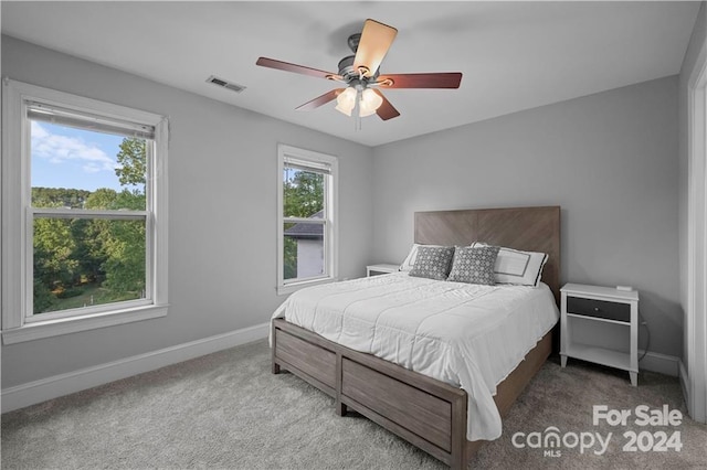 carpeted bedroom featuring ceiling fan