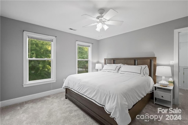 carpeted bedroom with ceiling fan