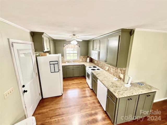 kitchen featuring sink, light wood-type flooring, ceiling fan, white appliances, and ornamental molding