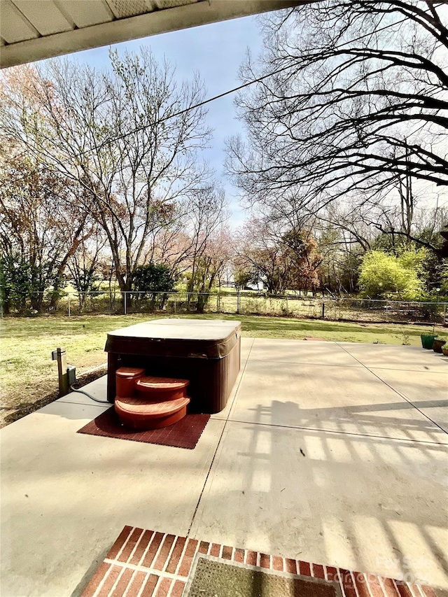 view of home's community with a patio and a jacuzzi