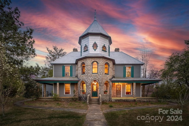 victorian house featuring a porch