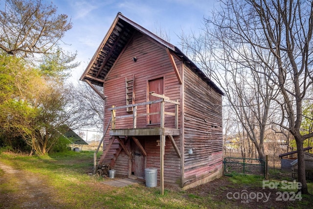 rear view of property with a yard