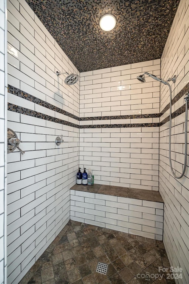 bathroom with a tile shower