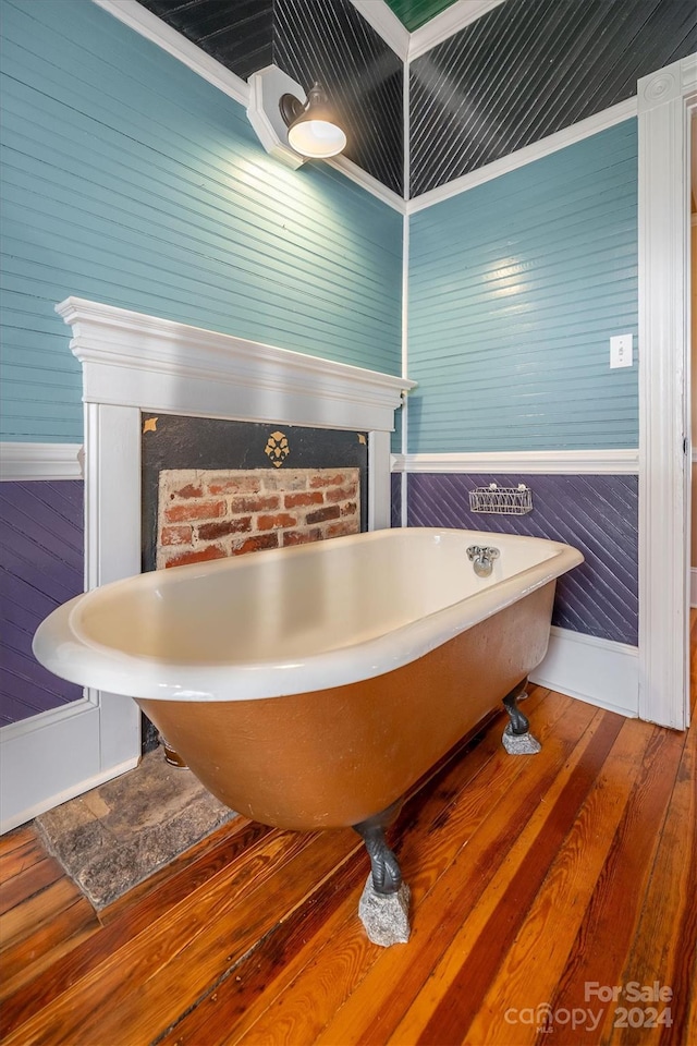 bathroom featuring ornamental molding and wood-type flooring