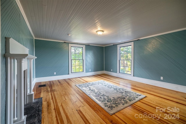 unfurnished room featuring light hardwood / wood-style flooring and ornamental molding