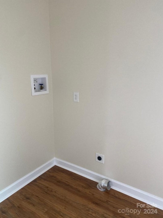 washroom featuring dark wood-type flooring, hookup for an electric dryer, and hookup for a washing machine