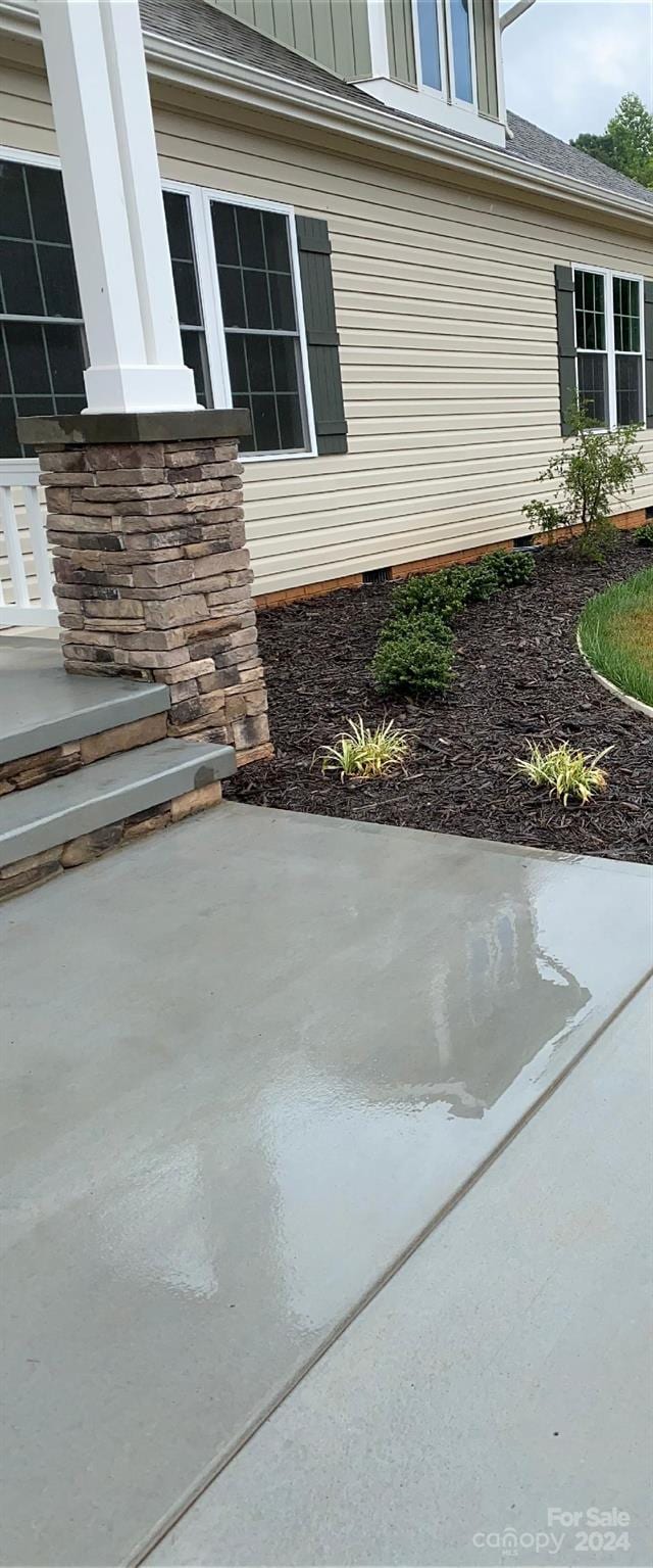 view of property exterior featuring a patio area