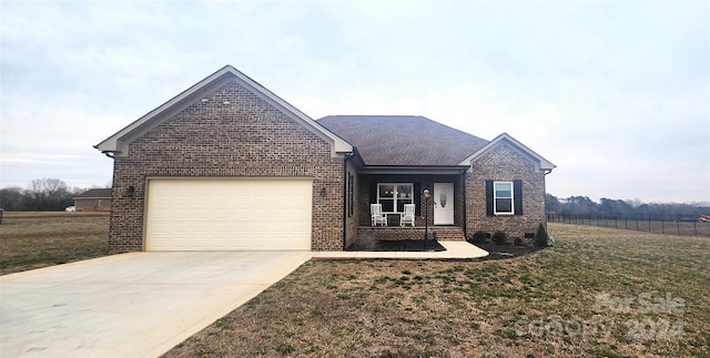 view of front facade featuring a garage and a front lawn