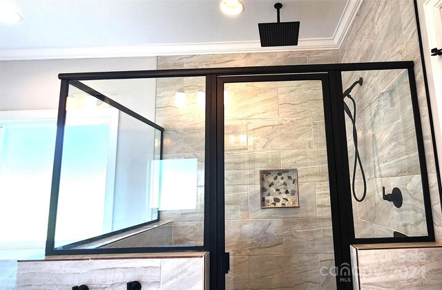 room details with an enclosed shower and ornamental molding