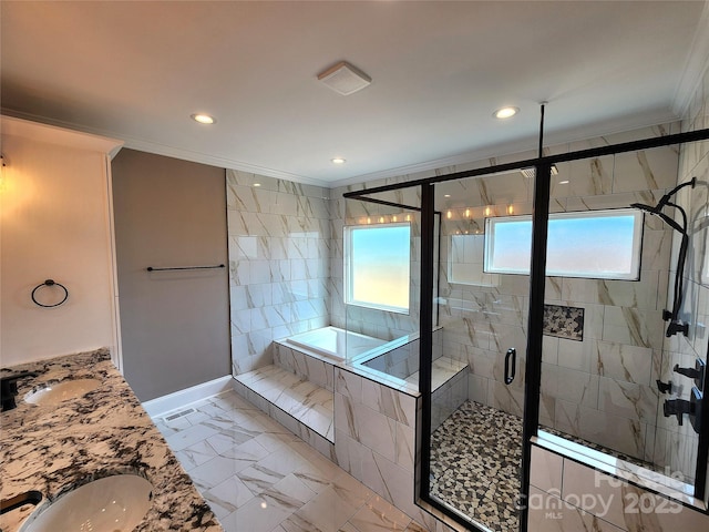 bathroom featuring a shower stall, a garden tub, ornamental molding, and a sink