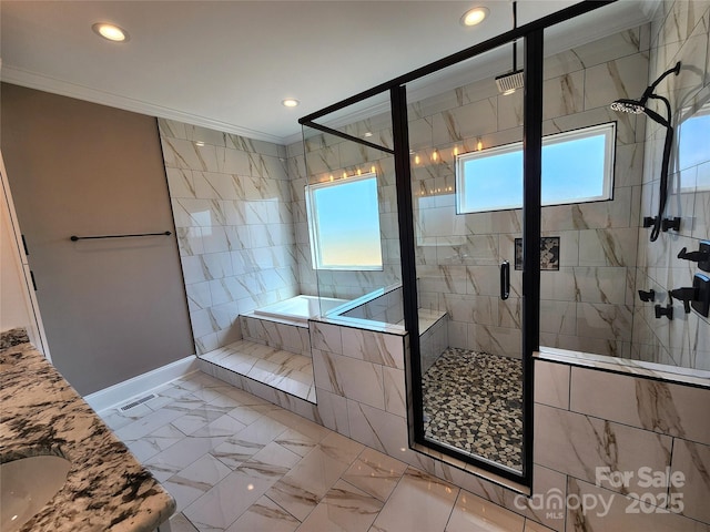 bathroom with recessed lighting, a shower stall, crown molding, baseboards, and a garden tub