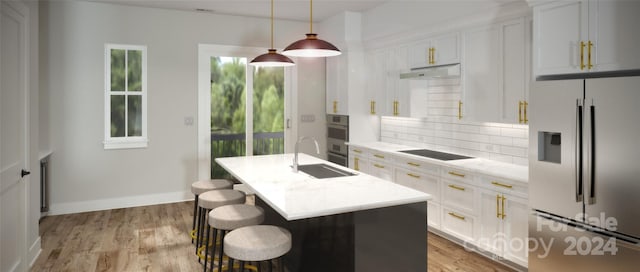 kitchen with backsplash, an island with sink, white cabinets, stainless steel fridge with ice dispenser, and decorative light fixtures