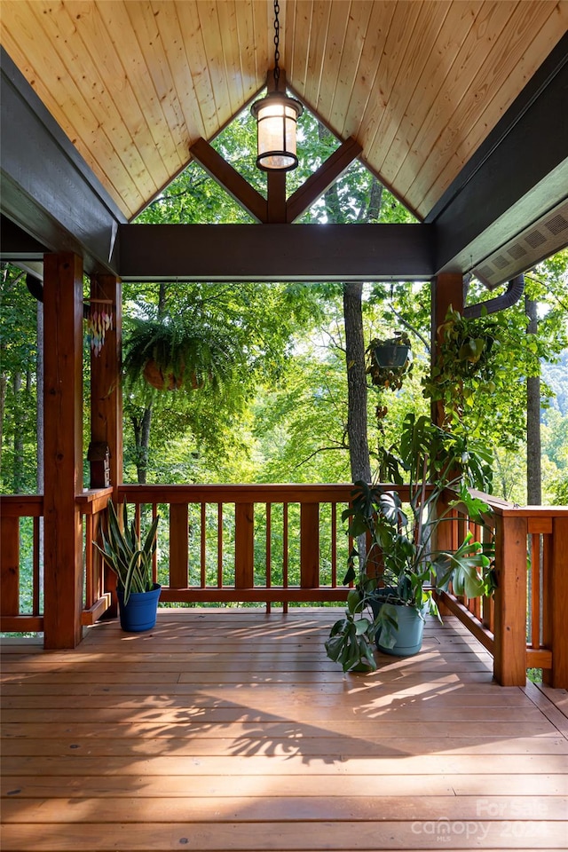 wooden terrace featuring a gazebo