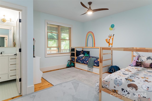 bedroom with light hardwood / wood-style floors and ceiling fan