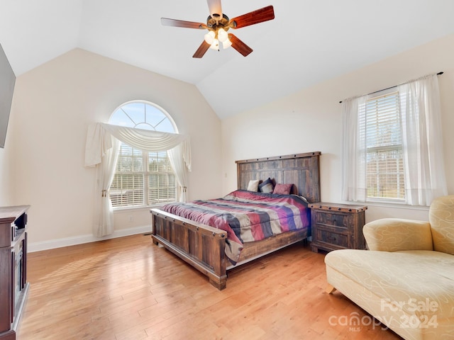 bedroom with lofted ceiling, light hardwood / wood-style floors, and ceiling fan