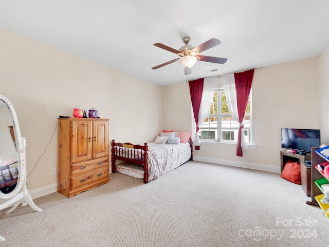 bedroom featuring ceiling fan and light carpet