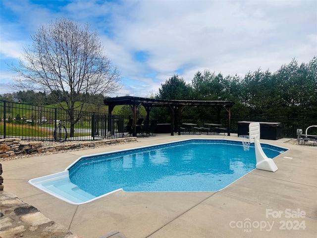 view of pool featuring a pergola and a patio area