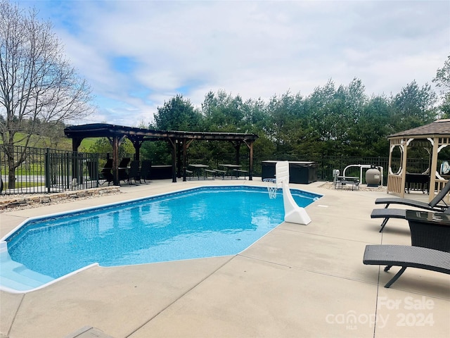 view of pool with a patio area and a pergola