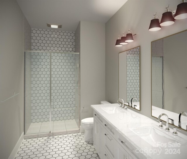 bathroom with oversized vanity, double sink, a shower with shower door, tile floors, and toilet