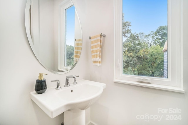 bathroom featuring sink and a wealth of natural light