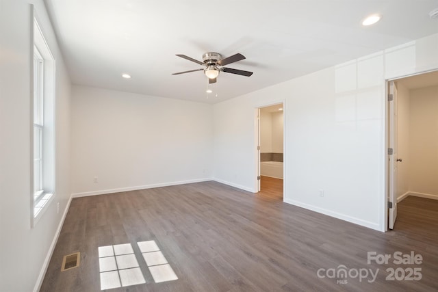 empty room featuring ceiling fan and wood-type flooring