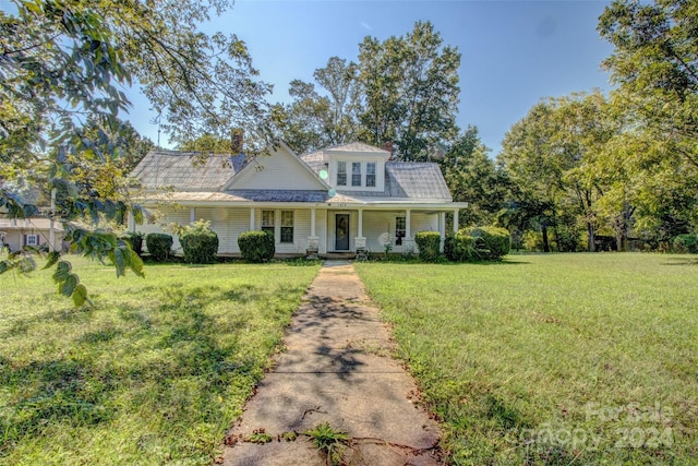 view of front of home with a porch and a front lawn