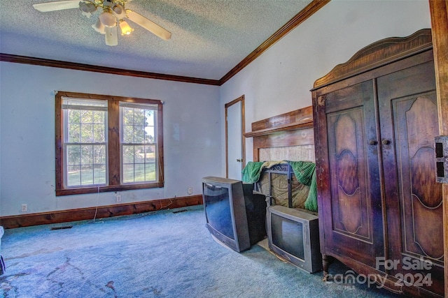 interior space featuring light carpet, crown molding, a textured ceiling, and ceiling fan