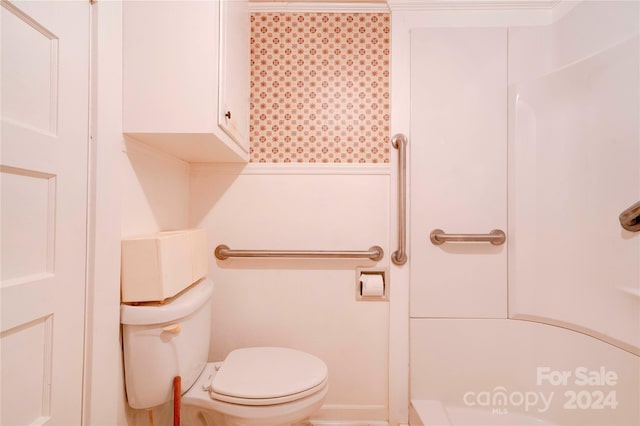 bathroom with toilet and ornamental molding