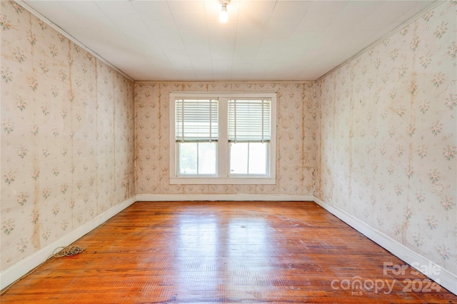 empty room featuring wood-type flooring