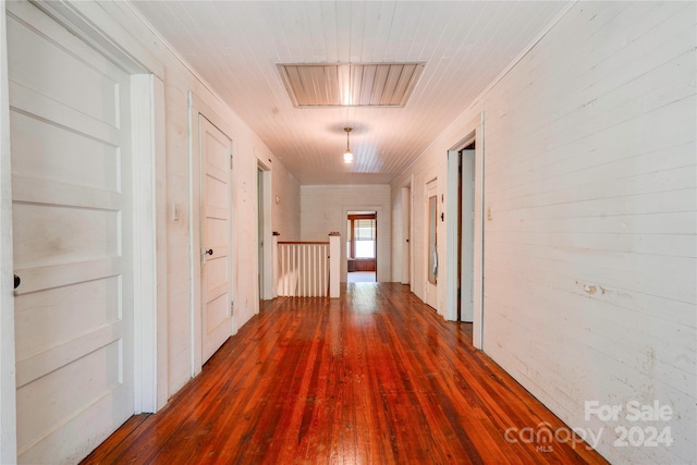 hallway featuring wood-type flooring and wooden ceiling