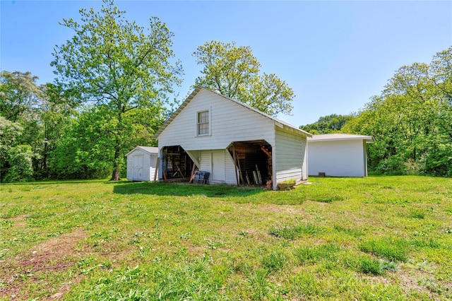 exterior space with a yard and a storage shed