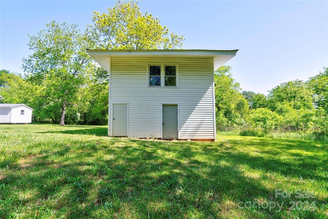 back of property with a yard