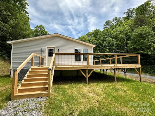 back of property with a wooden deck