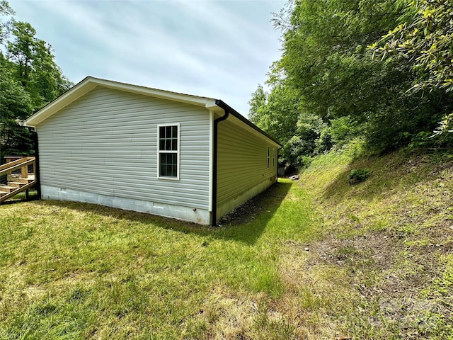 view of home's exterior with a lawn