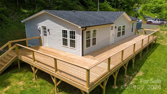 back of house with a lawn and a wooden deck