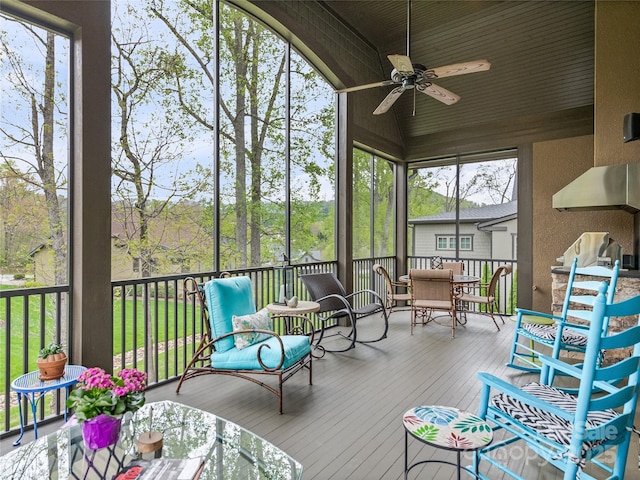 sunroom featuring ceiling fan