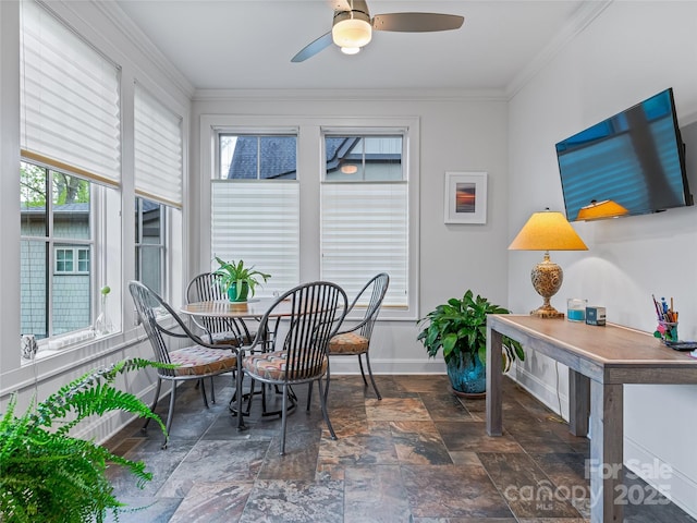 sunroom featuring ceiling fan and a healthy amount of sunlight