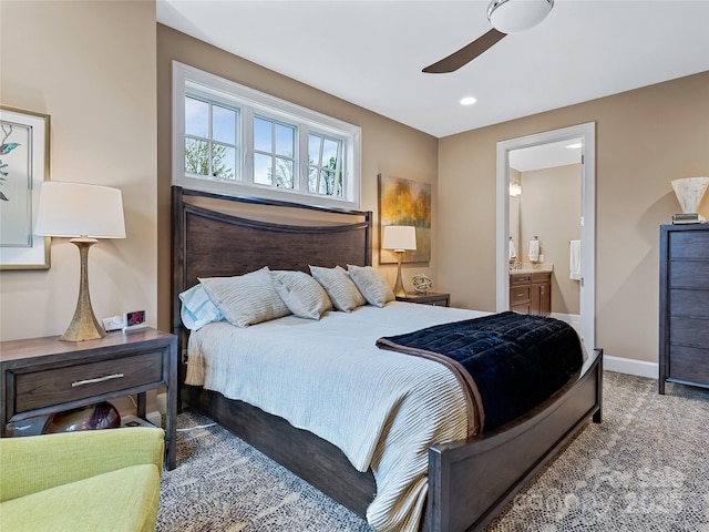 bedroom featuring ensuite bath and ceiling fan