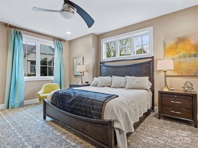 bedroom with ceiling fan and carpet