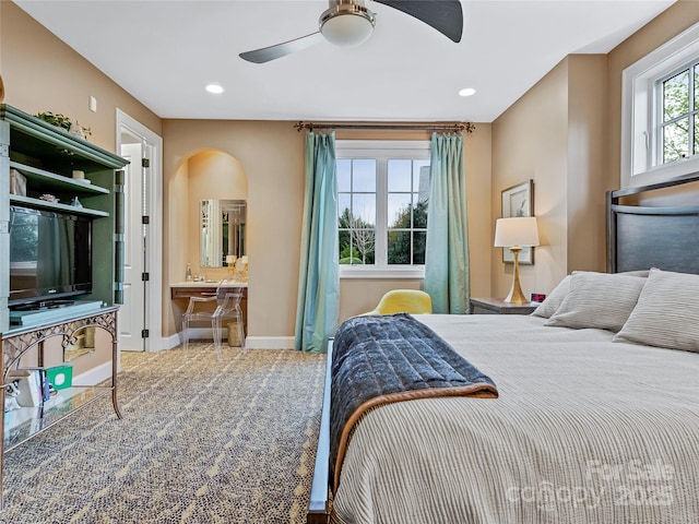 bedroom with ceiling fan and ensuite bathroom